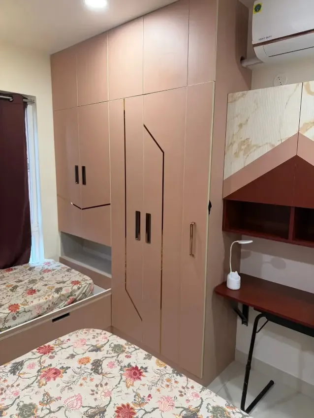 Soft pink bedroom wardrobes completed by Trifold, Chennai
