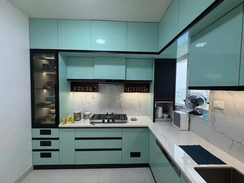 Teal modular kitchen completed by Trifold, Chennai