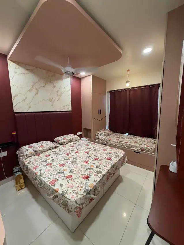 Warm-toned bedroom with custom wardrobe completed by Trifold, Chennai
