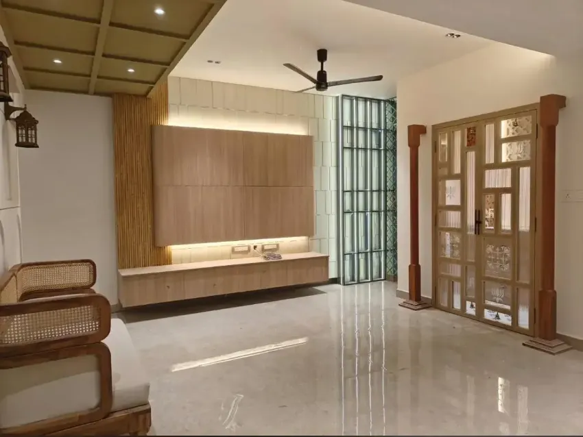 Warm contemporary living room completed by Trifold, Chennai