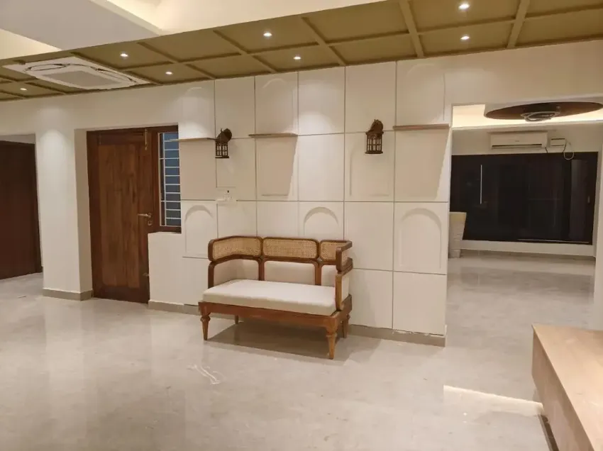 Living room with tailored wall panelling completed by Trifold, Chennai