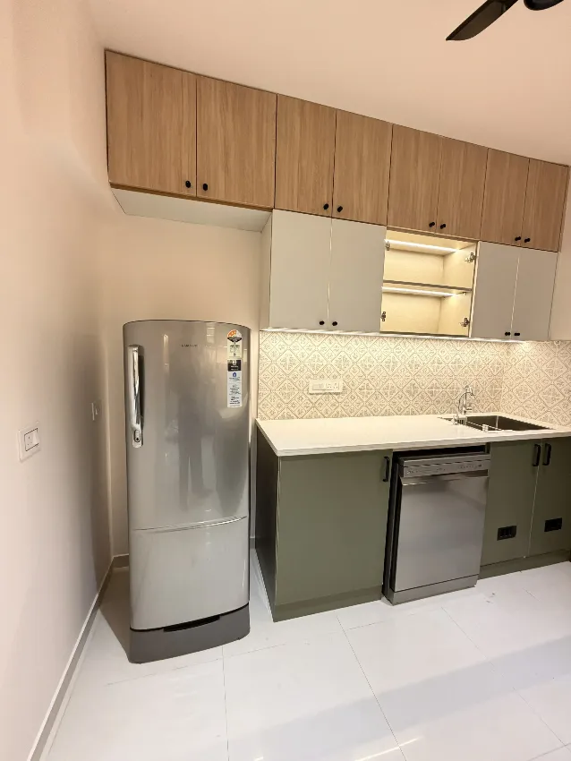 Light wood and grey modular kitchen completed by Trifold, Chennai
