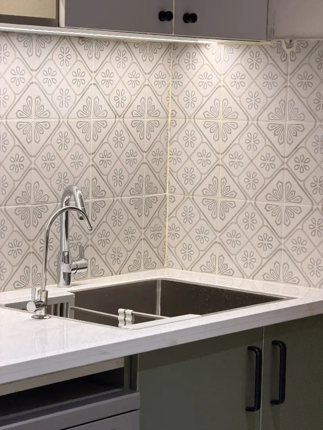 Kitchen sink and patterned backsplash detail completed by Trifold, Chennai