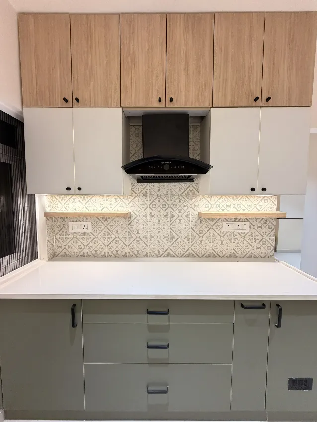 Full kitchen cabinetry and chimney wall completed by Trifold, Chennai