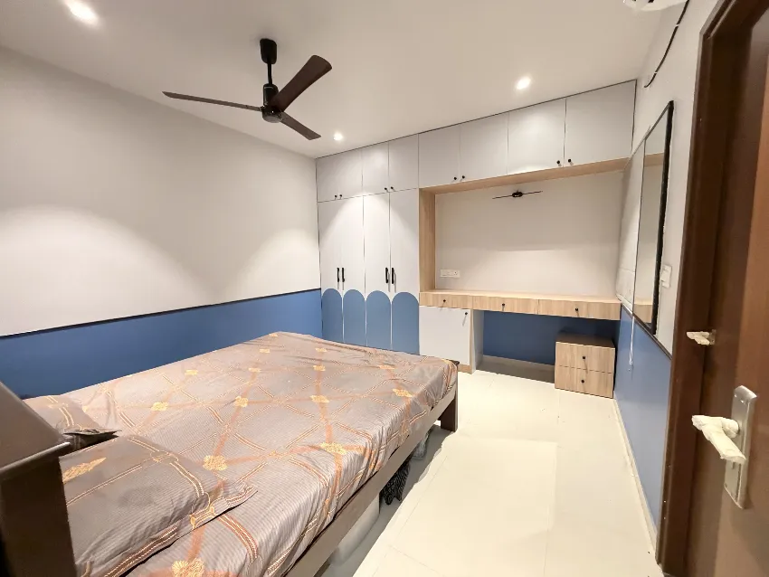 Blue children's bedroom with custom bed completed by Trifold, Chennai