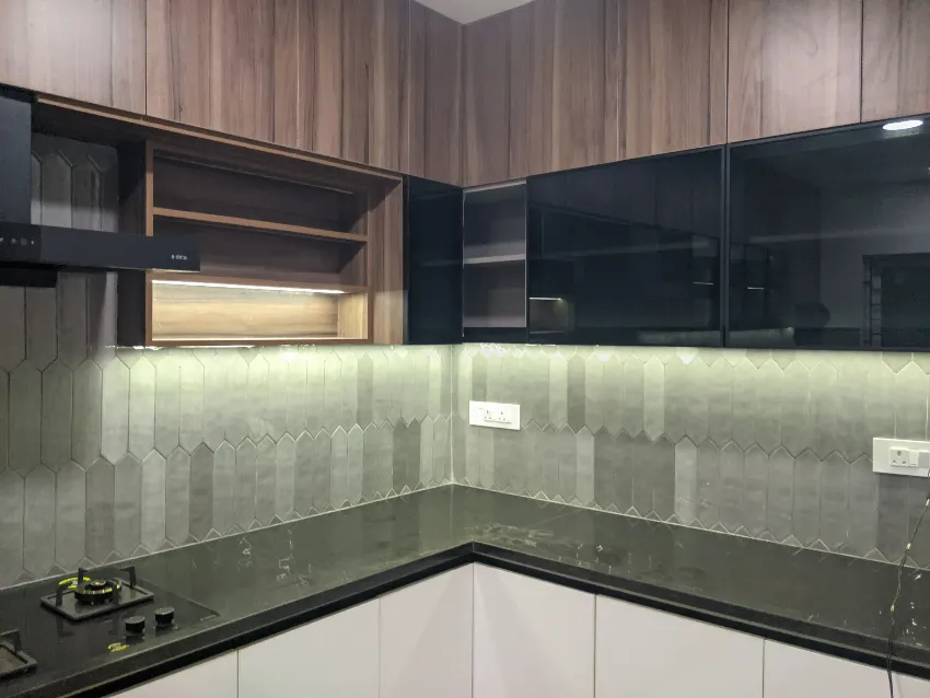 Dark wood and white modern kitchen completed by Trifold, Chennai