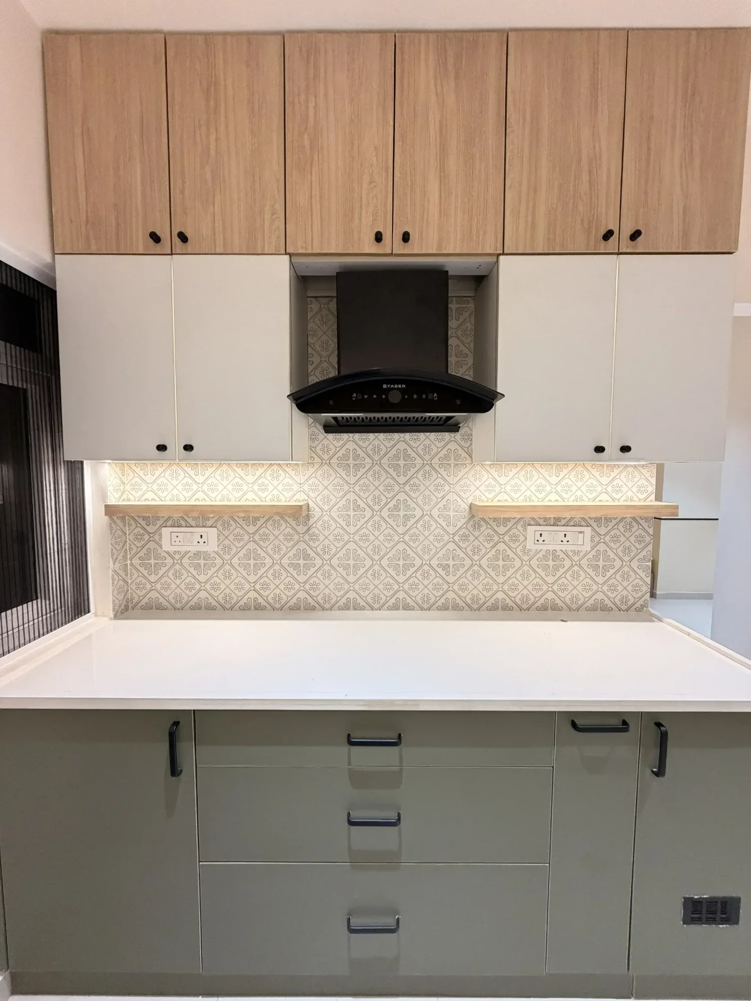 Full kitchen cabinetry and chimney wall completed by Trifold, Chennai