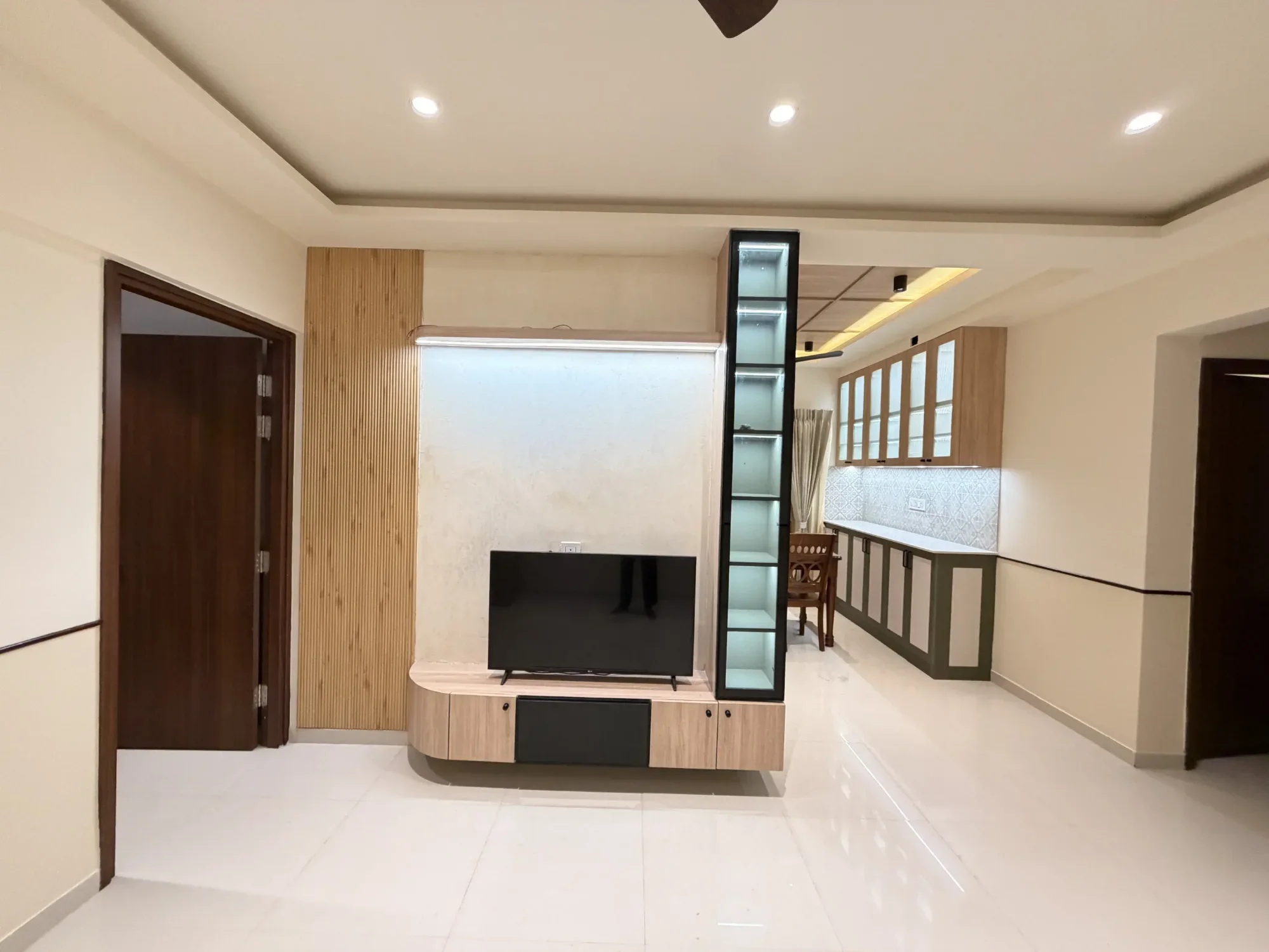 Floating television unit and display ledge completed by Trifold, Chennai